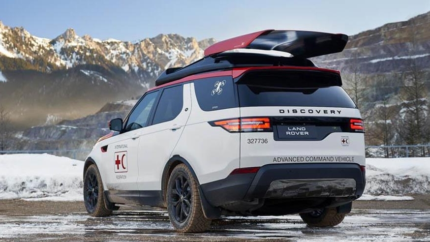 White Discovery in the snow with humanitarian and conservation branding on it